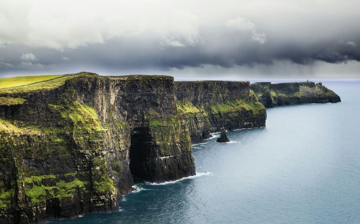 Cliffs of Moher on the west coast of Ireland, with storm clouds over the Atlantic