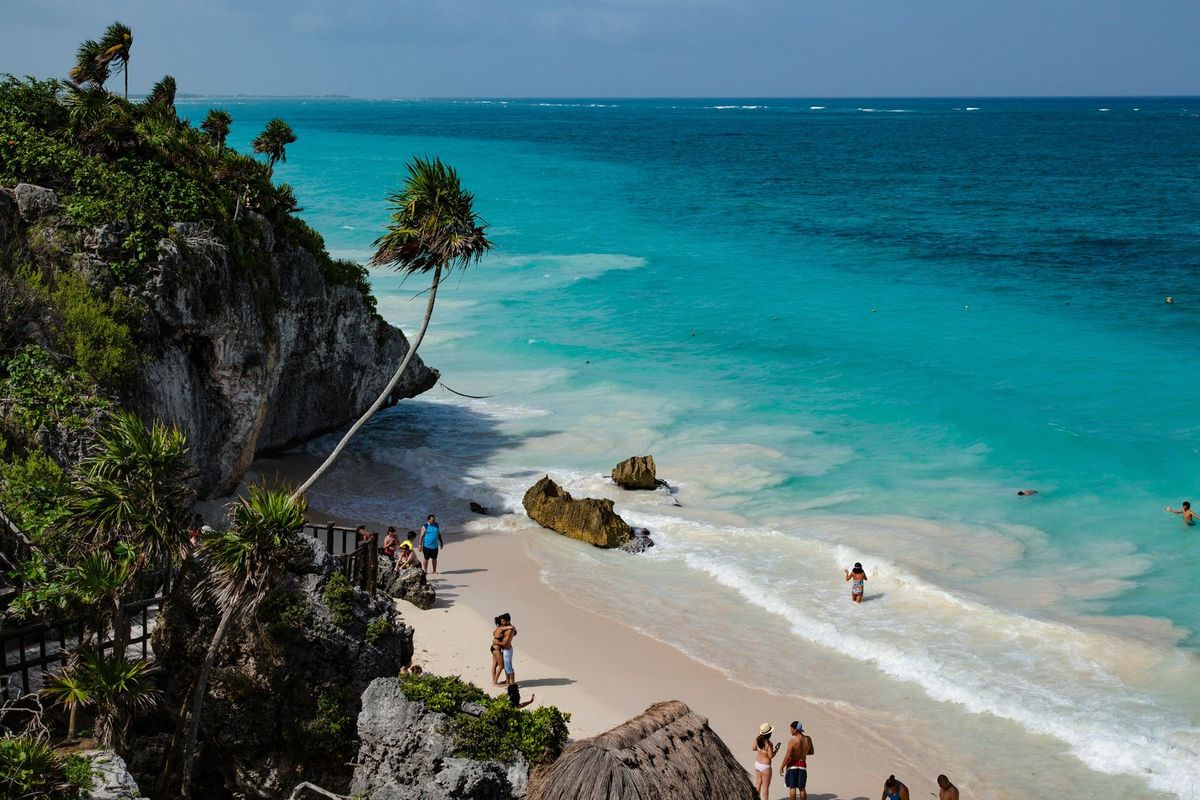 A small white-sand beach below the cliffs at Tulum on Mexico&rsquo;s Caribbean coast